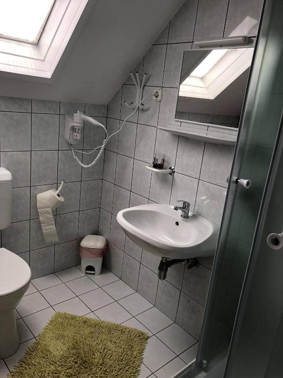 Kúpeľňa v ubytovaní Major család apartman