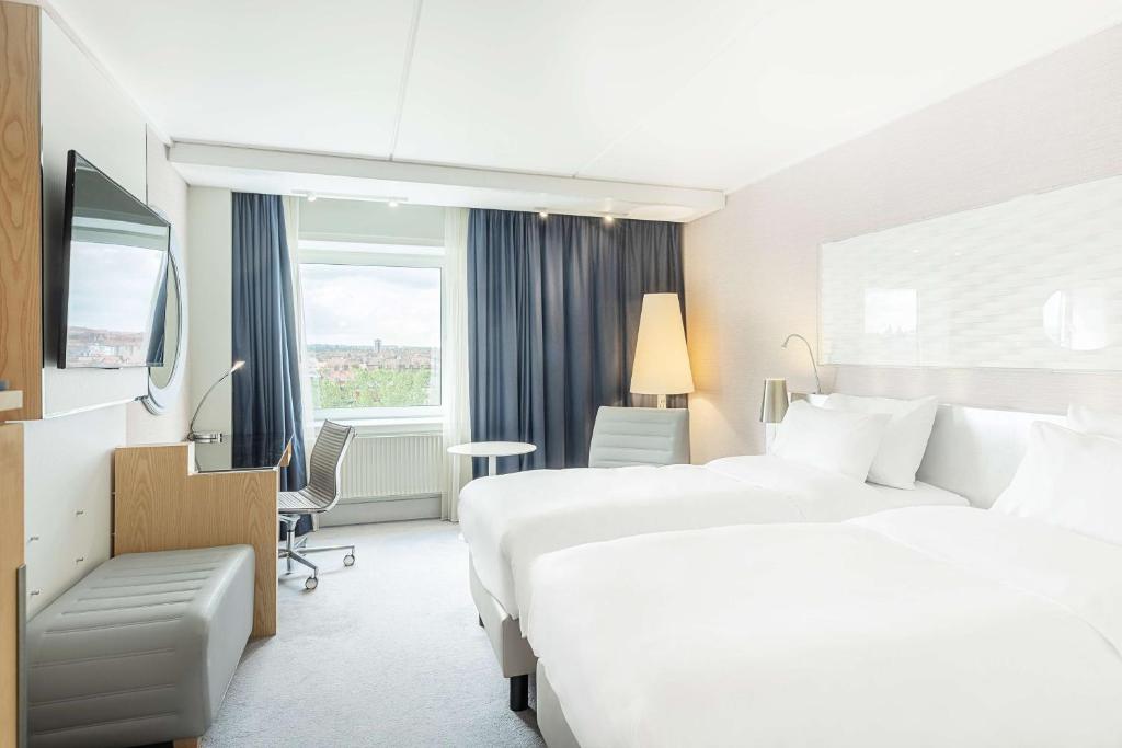 Postel nebo postele na pokoji v ubytování Radisson Blu Scandinavia Hotel Aarhus