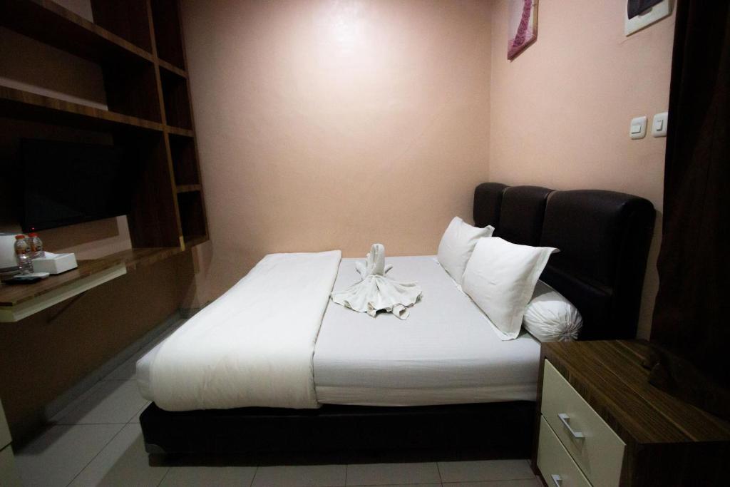 Postel nebo postele na pokoji v ubytování O2 Residence