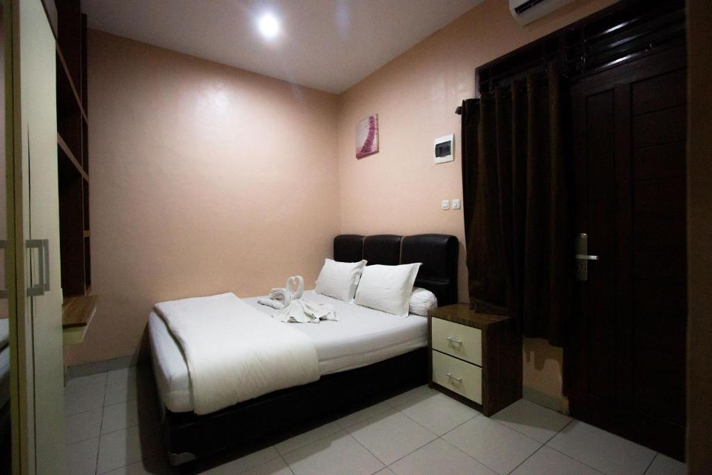 Postel nebo postele na pokoji v ubytování O2 Residence