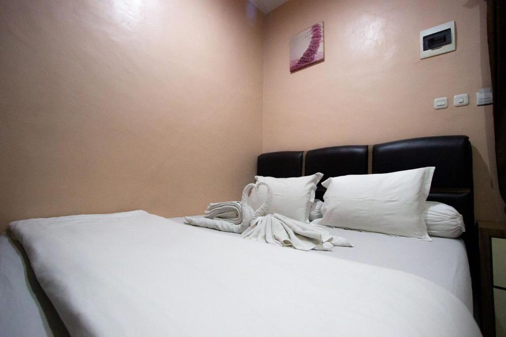 Postel nebo postele na pokoji v ubytování O2 Residence
