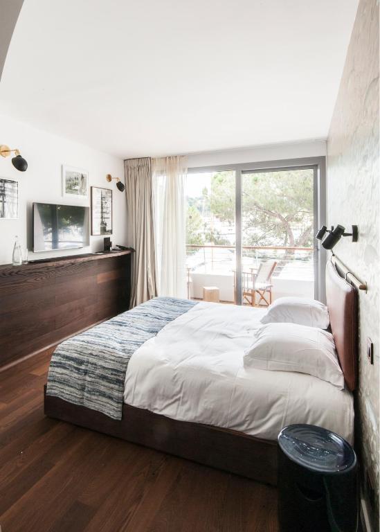 Postel nebo postele na pokoji v ubytování Boutique Hotel Miramar