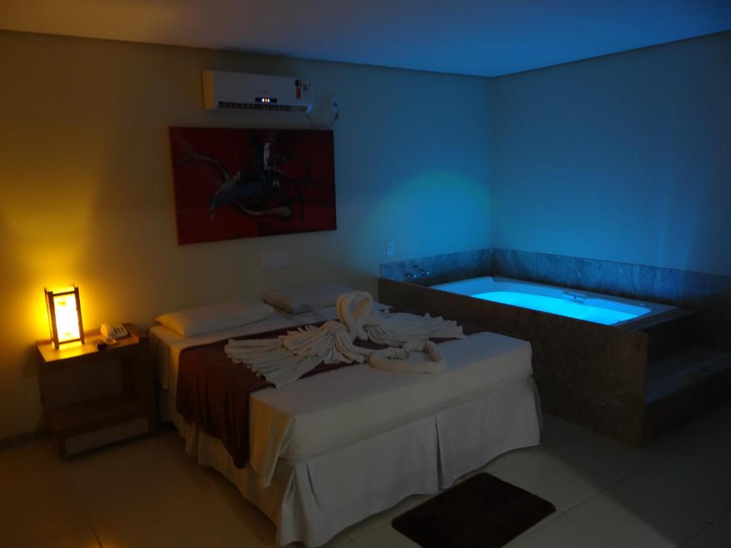 Postel nebo postele na pokoji v ubytování Porto Bali Hotel