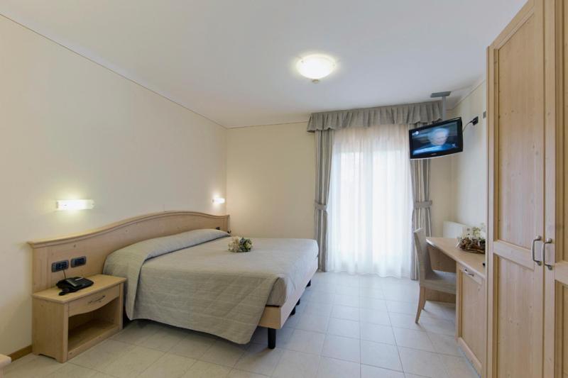 Postel nebo postele na pokoji v ubytování Hotel Select