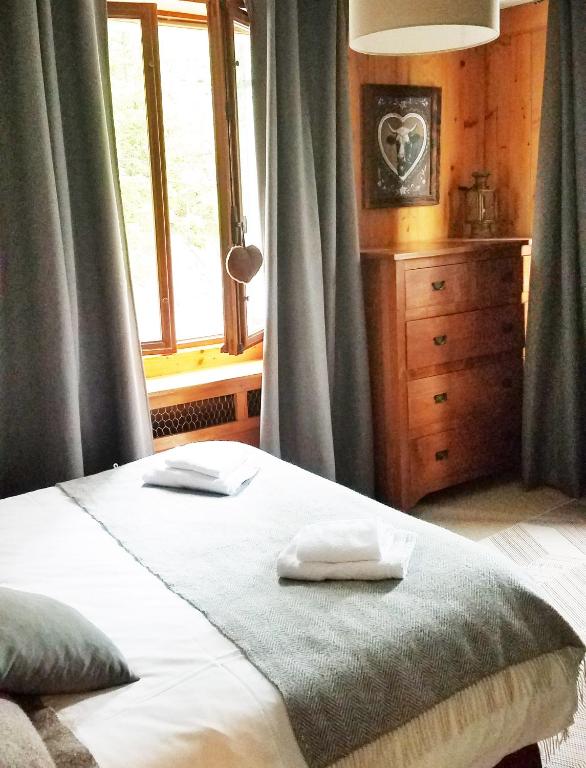 Postel nebo postele na pokoji v ubytování Chalet de Roselend