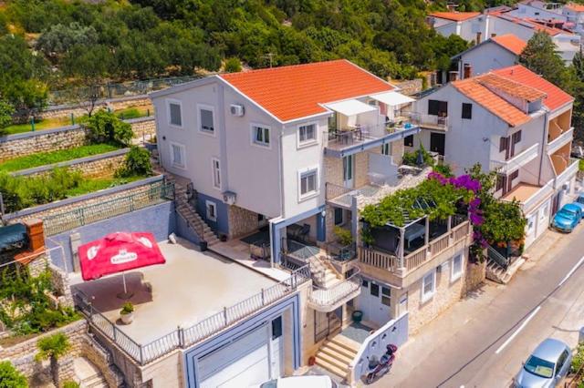 an overhead view of a large house with a red roof at Apartments Bora in Neum