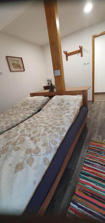 Postel nebo postele na pokoji v ubytování Fehérkőlápa Turistaház Panzió