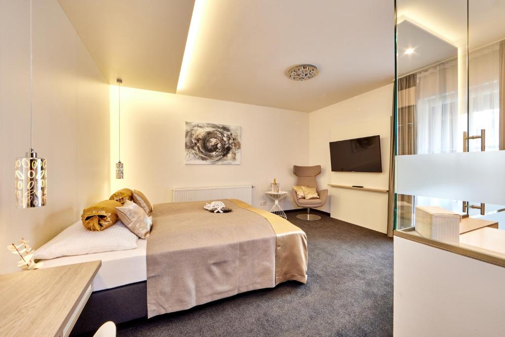 Postel nebo postele na pokoji v ubytování Hotel Alter Wirth