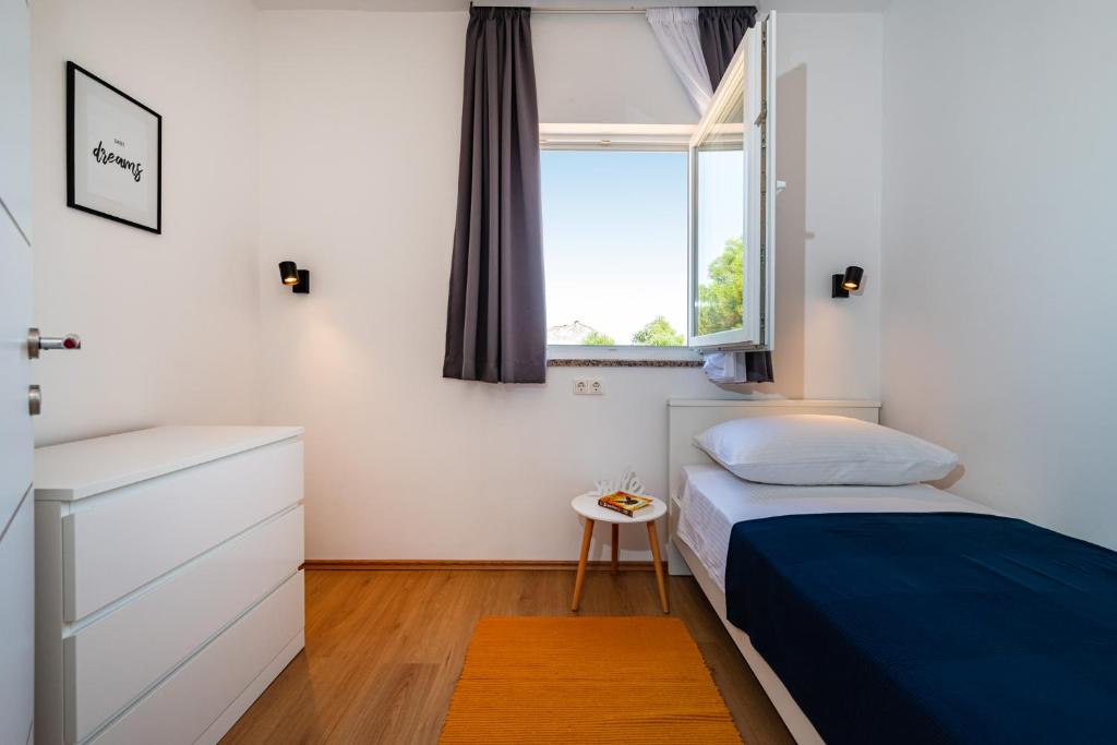 Łóżko lub łóżka w pokoju w obiekcie la More Apartments