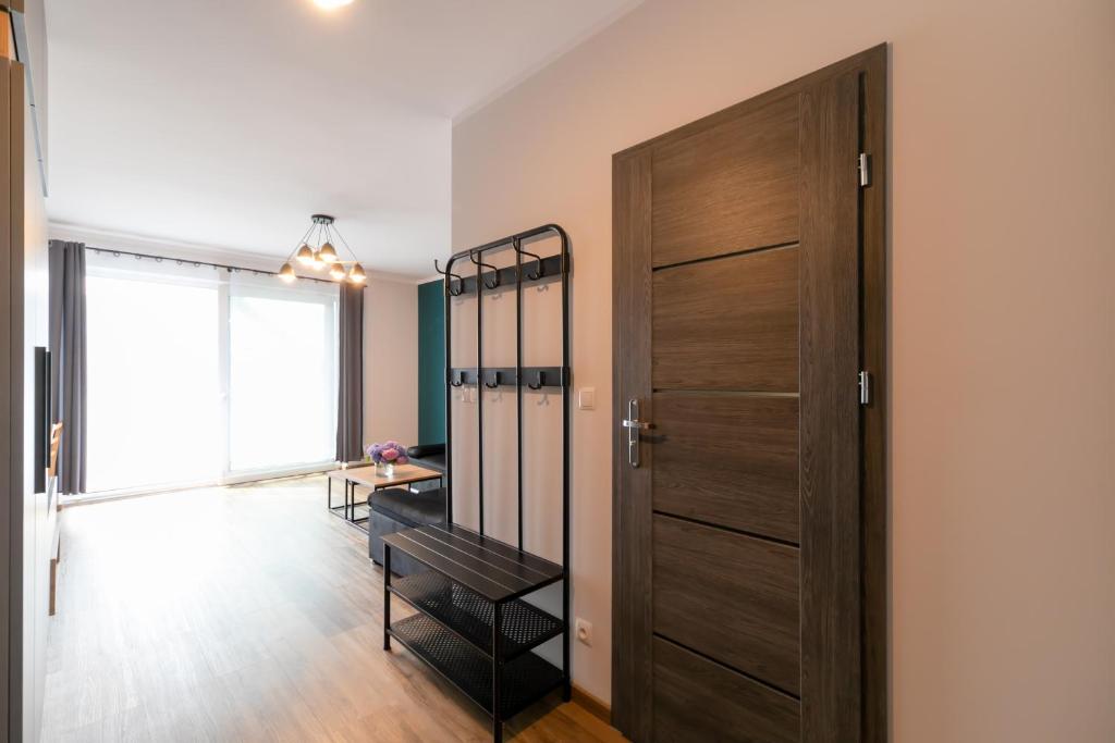 Posteľ alebo postele v izbe v ubytovaní Apartamenty Pod Lasem z klimatyzacją i 2 sypialniami - Dream Apart