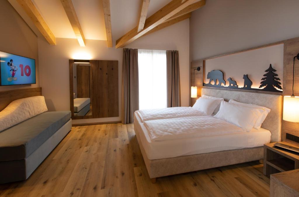 Postel nebo postele na pokoji v ubytování Àlia Bianca Active & Family Hotel