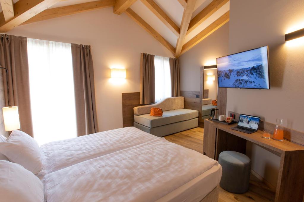 Postel nebo postele na pokoji v ubytování Àlia Bianca Active & Family Hotel