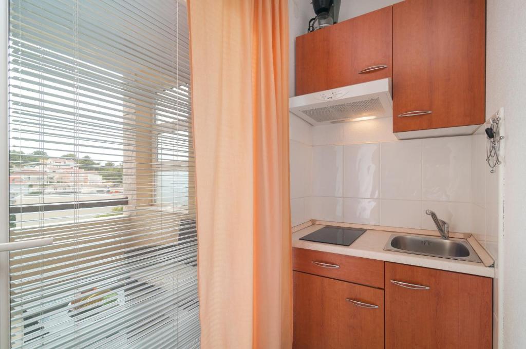 Kuchyň nebo kuchyňský kout v ubytování Apartments Molo Mare