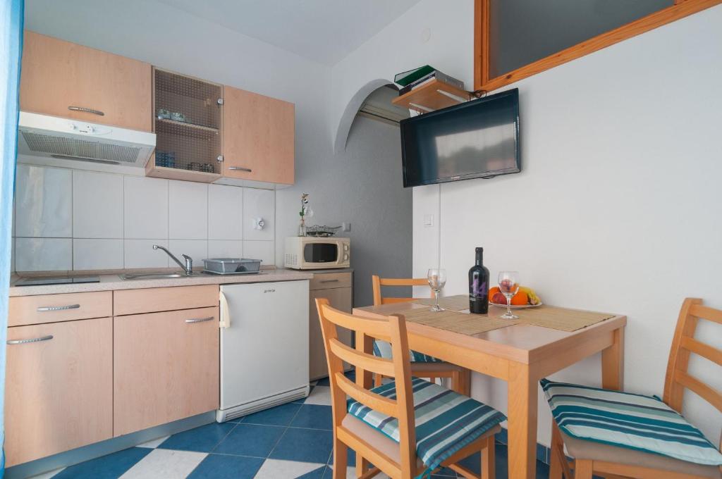 Kuchyň nebo kuchyňský kout v ubytování Apartments Molo Mare