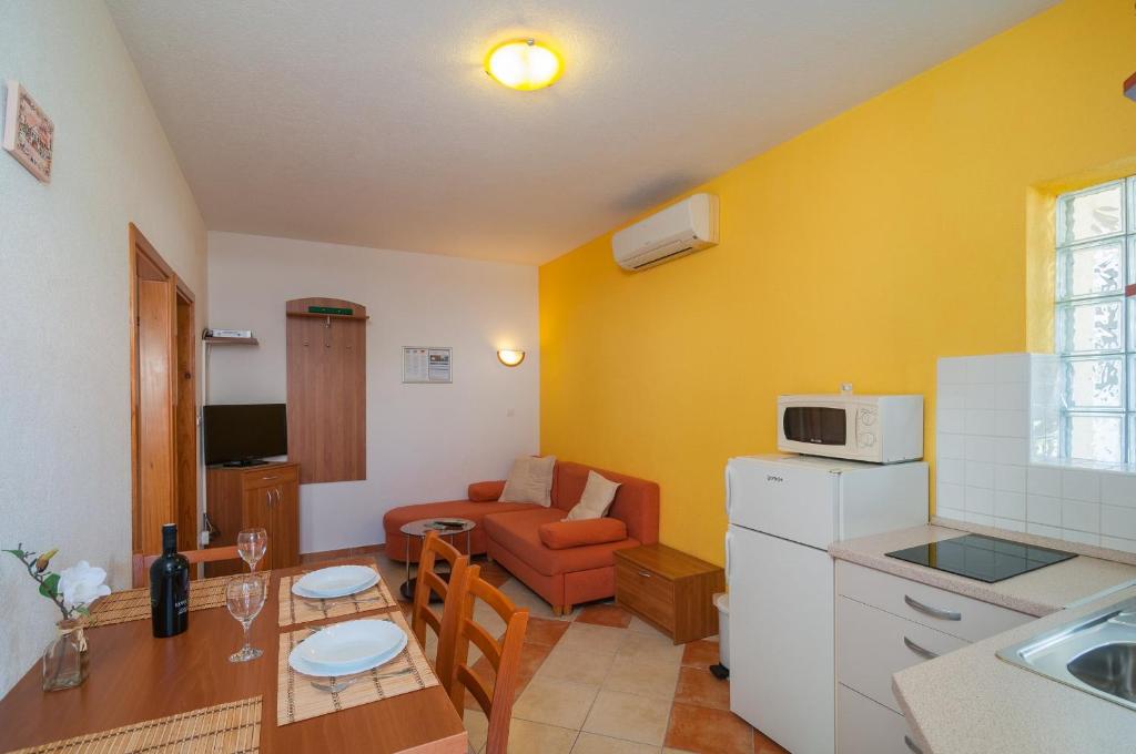 Kuchyň nebo kuchyňský kout v ubytování Apartments Molo Mare