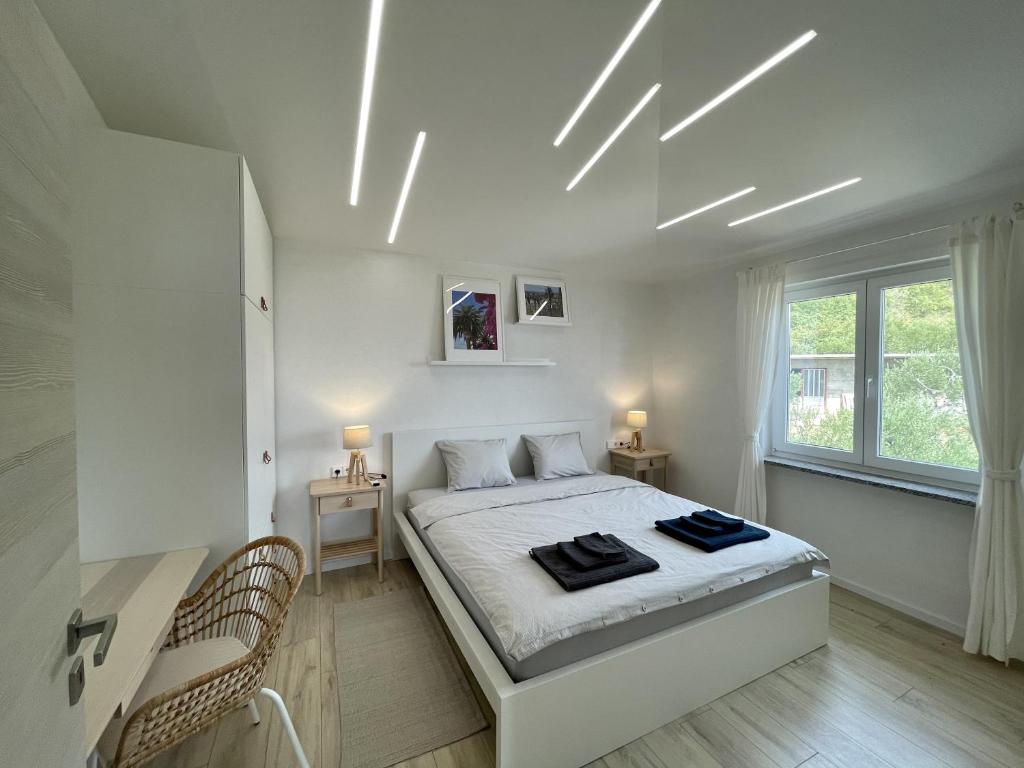 Postel nebo postele na pokoji v ubytování Lambda Holiday Apartments