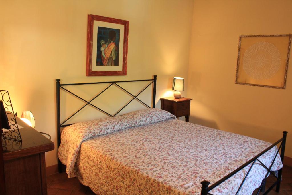 A bed or beds in a room at Il Giardino Segreto