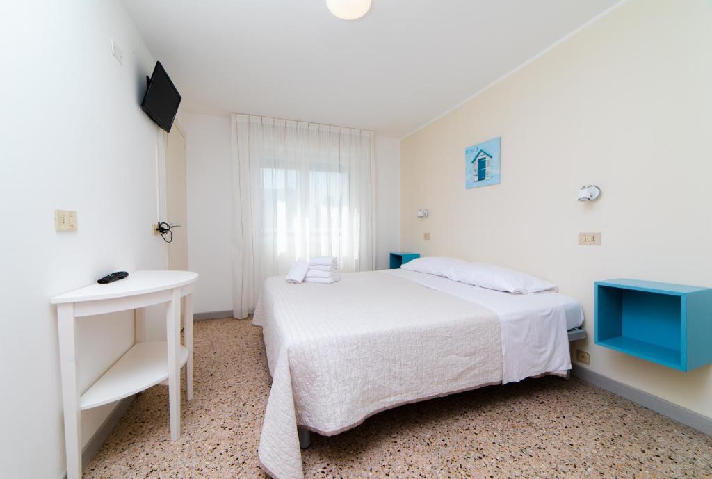 Postel nebo postele na pokoji v ubytování Hotel 21 Riccione