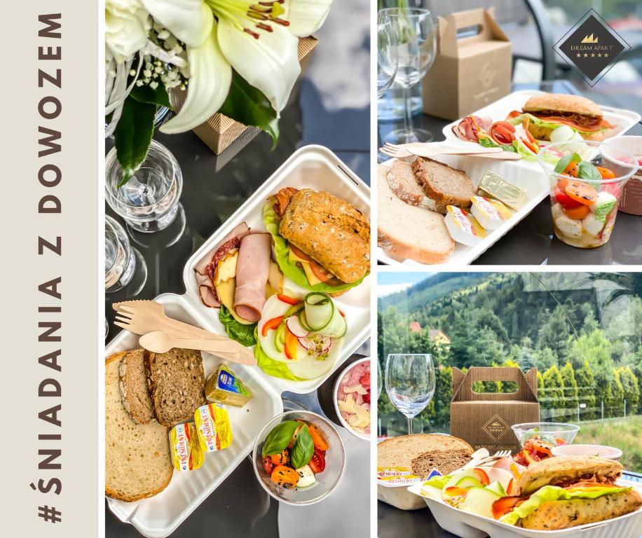 Assorted takeaway breakfast boxes with sandwiches, salads and glasses on table, outdoor mountain view.