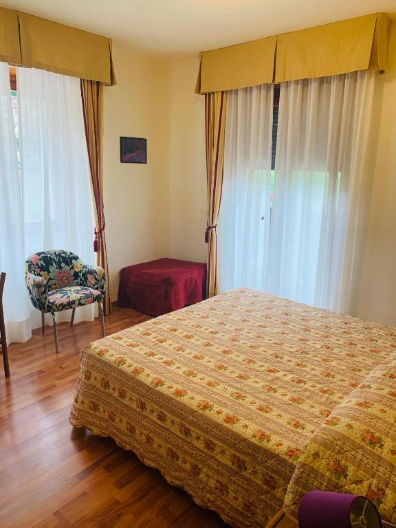 Postel nebo postele na pokoji v ubytování Hotel Genzianella