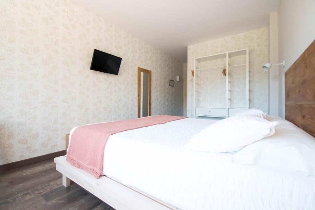 Postel nebo postele na pokoji v ubytování Hotel Casa Cauma