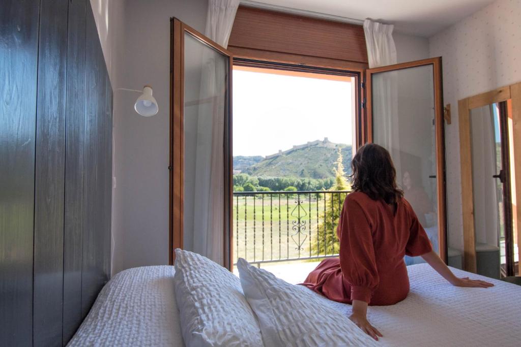 Postel nebo postele na pokoji v ubytování Hotel Casa Cauma