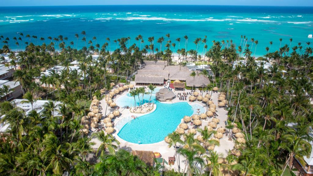 an aerial view of a resort with a pool and the ocean at Grand Palladium Palace Resort Spa & Casino - All Inclusive in Punta Cana