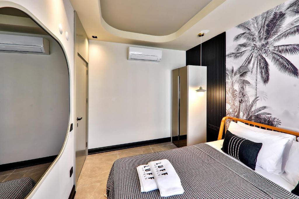 Postel nebo postele na pokoji v ubytování Luff Suites