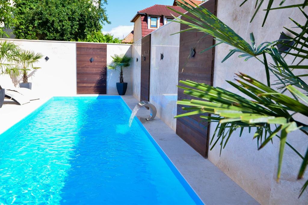 a swimming pool in the backyard of a house at Boutique Damiani in Sibiu