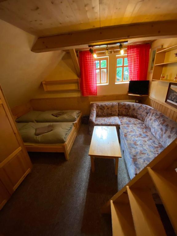Postel nebo postele na pokoji v ubytování Lovecká chata