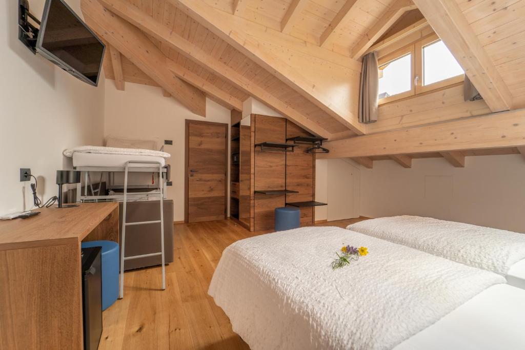 A bed or beds in a room at Agritur La Crucola