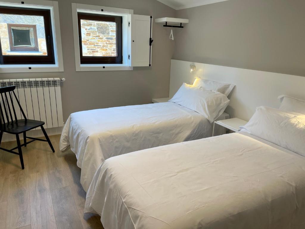 Tempat tidur dalam kamar di Casa Galego
