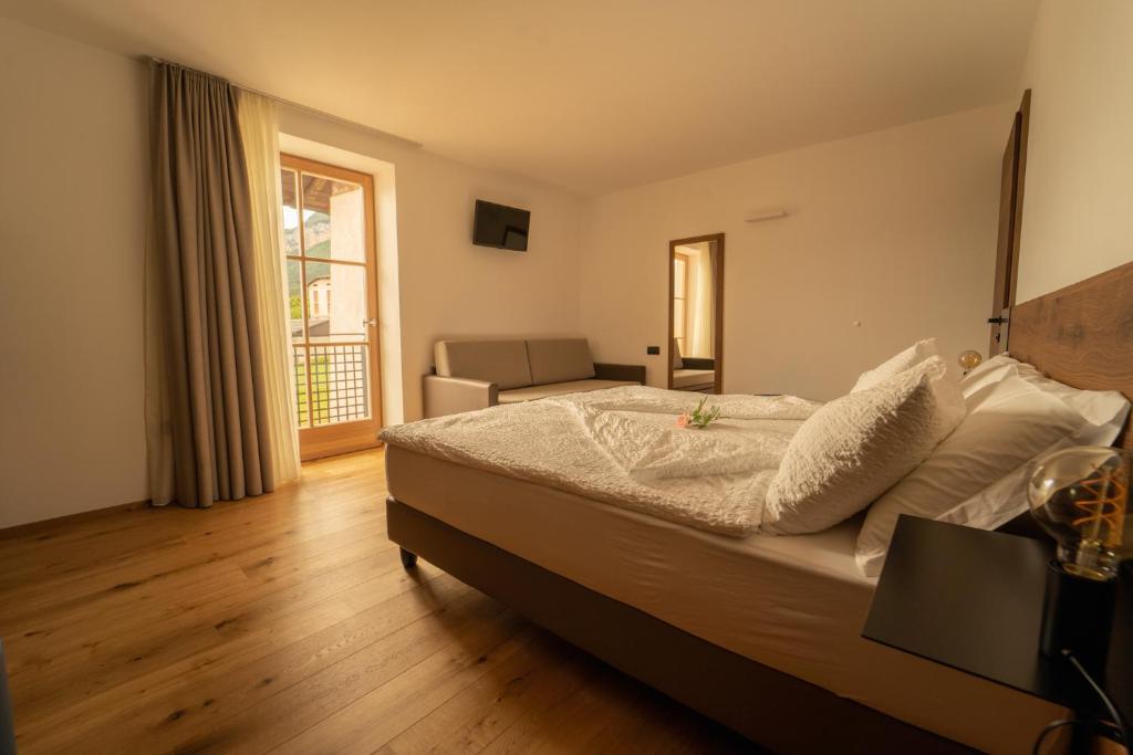 A bed or beds in a room at Agritur La Crucola