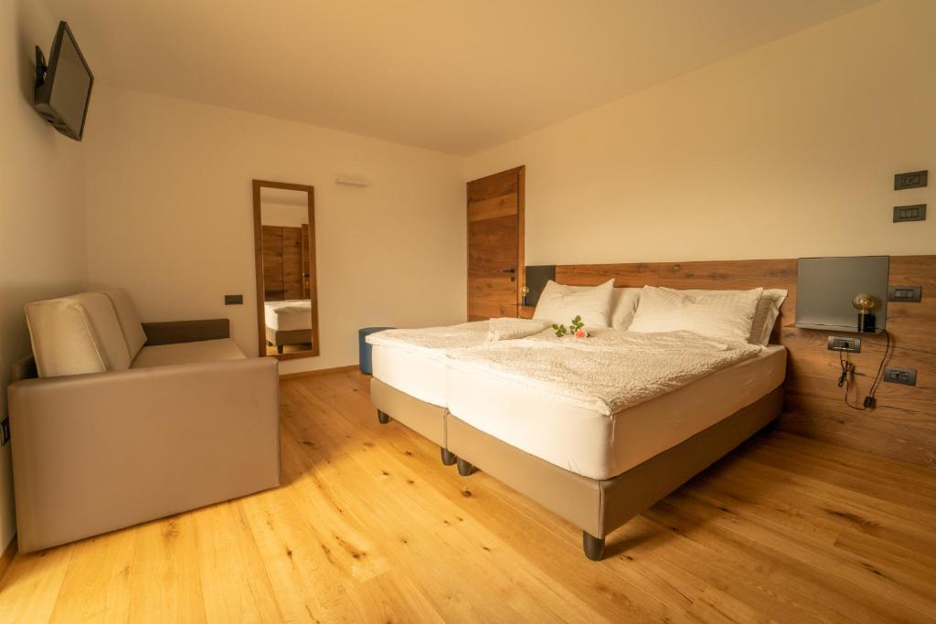 A bed or beds in a room at Agritur La Crucola