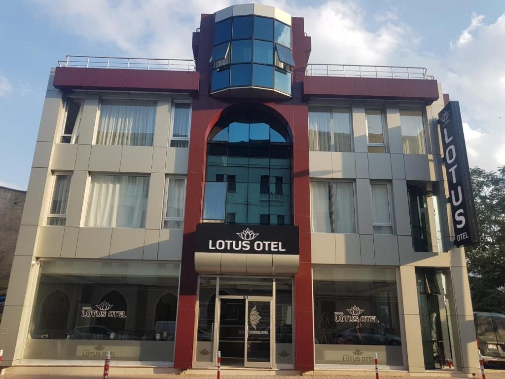 a building with a sign that reads louis out at LOTUS OTEL in Konya