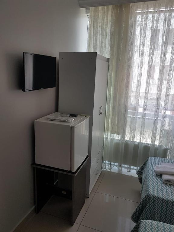TV a/nebo společenská místnost v ubytování LOTUS OTEL