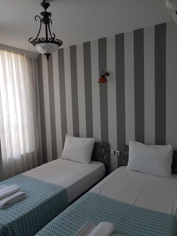 Postel nebo postele na pokoji v ubytování LOTUS OTEL