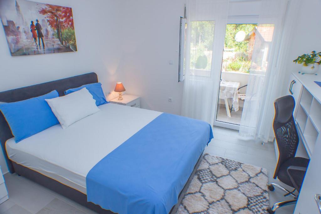 Postel nebo postele na pokoji v ubytování Apartments KOVAC