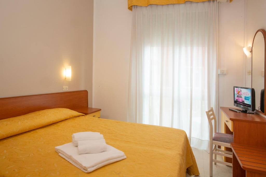 Postel nebo postele na pokoji v ubytování Hotel Carnaby