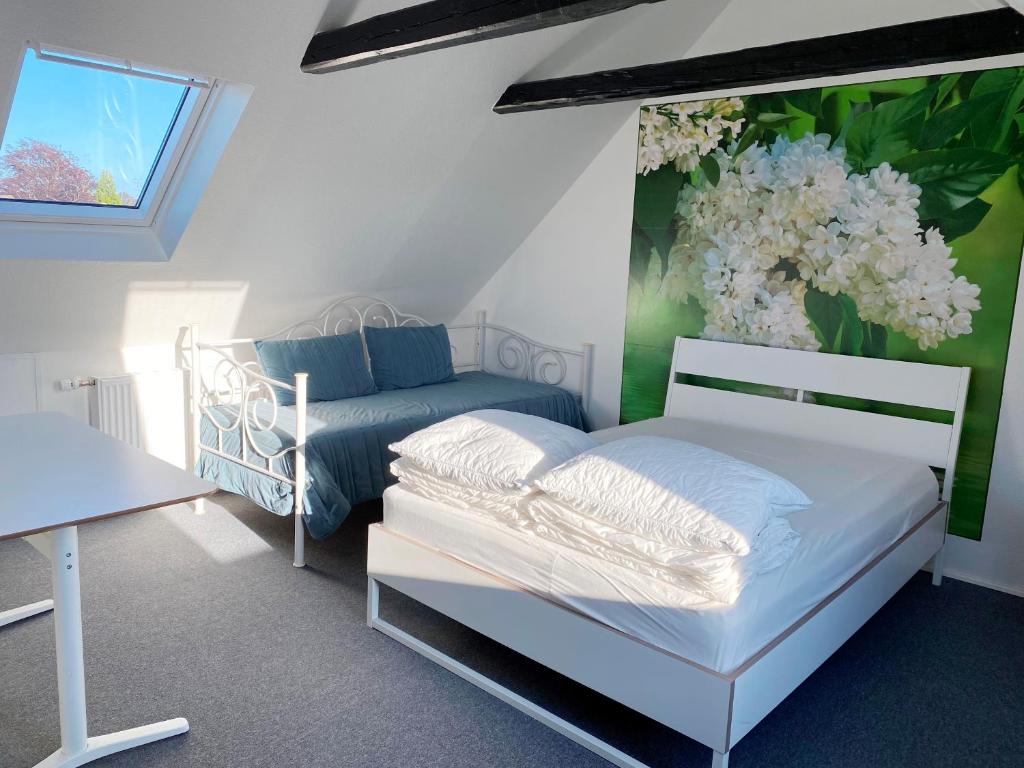 Postel nebo postele na pokoji v ubytování Holiday rooms Rudkøbing