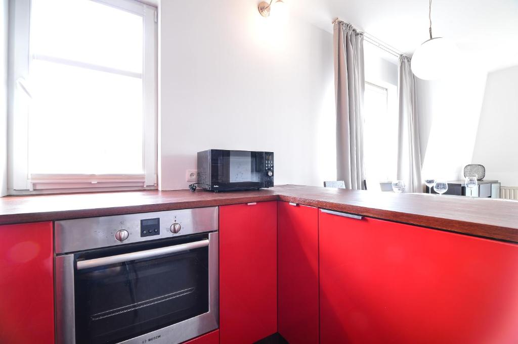Kuchyň nebo kuchyňský kout v ubytování CITYSTAY Parkur Sopot Apartment