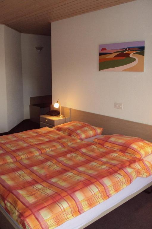 Letto o letti in una camera di Auberge Restaurant Couronne