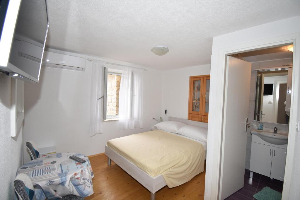 Posteľ alebo postele v izbe v ubytovaní Apartmani Mihaela