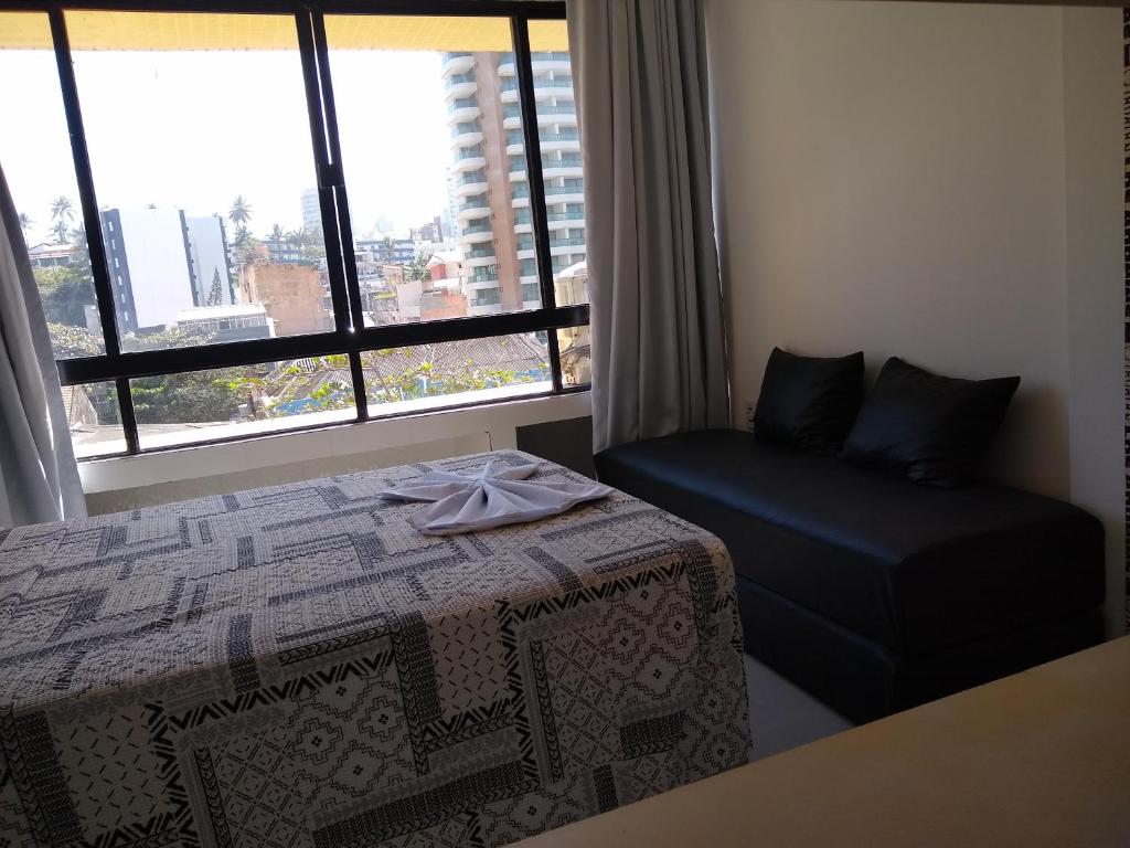 En eller flere senge i et værelse på Farol da Barra 315