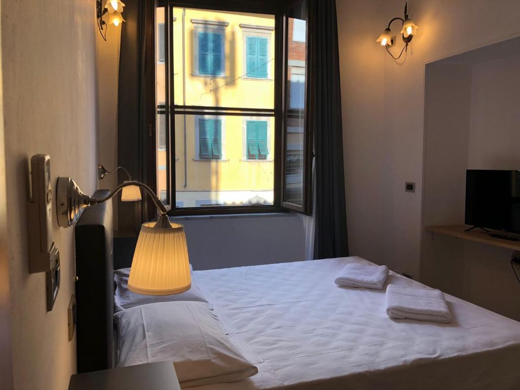 Postel nebo postele na pokoji v ubytování Hotel Francesco