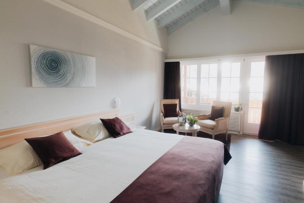 Postel nebo postele na pokoji v ubytování Wellnesshotel Schweizerhof