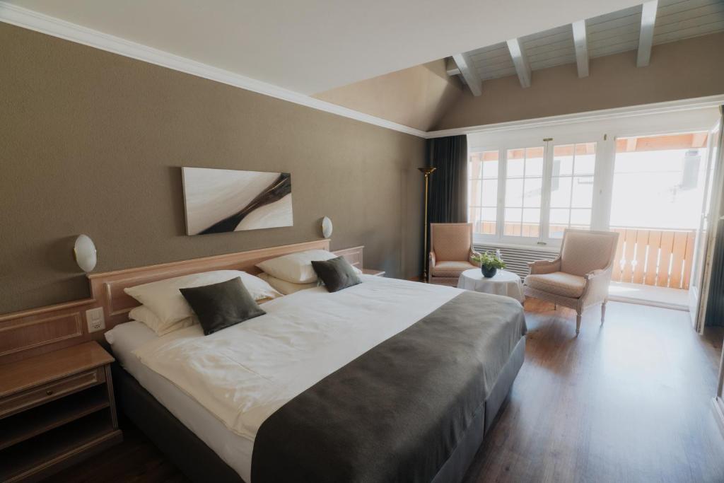 Postel nebo postele na pokoji v ubytování Wellnesshotel Schweizerhof