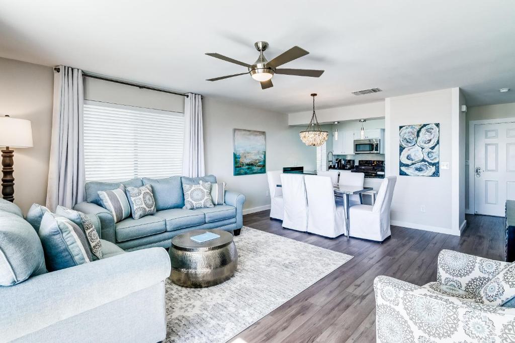 a living room with a couch and a table at Beach Bahr Den in Santa Rosa Beach