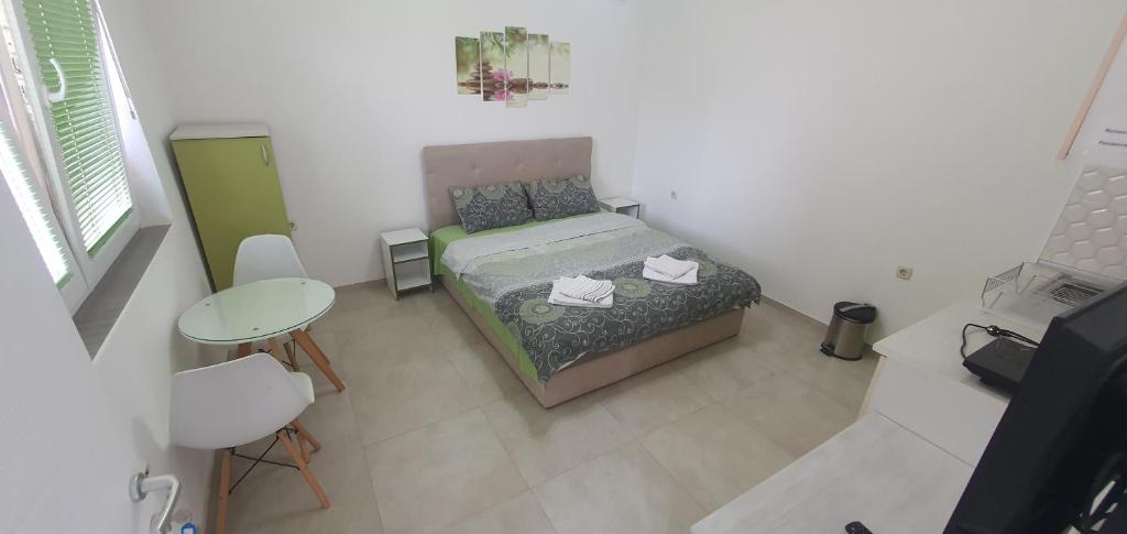 Postel nebo postele na pokoji v ubytování Antonio Apartments