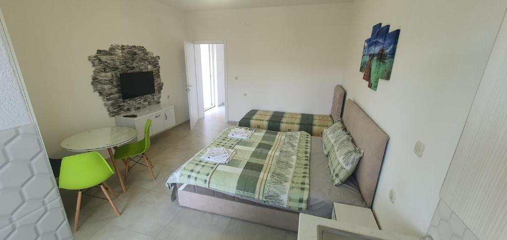 Postel nebo postele na pokoji v ubytování Antonio Apartments